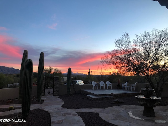 view of patio terrace at dusk