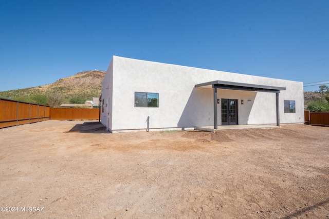 rear view of house with a mountain view