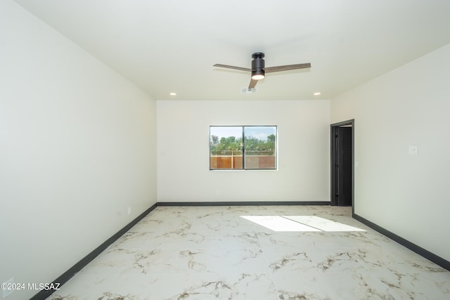 spare room with ceiling fan