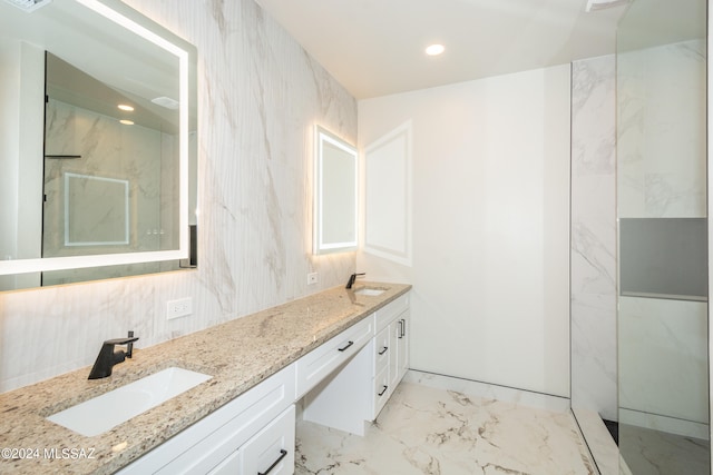 bathroom featuring vanity and a shower