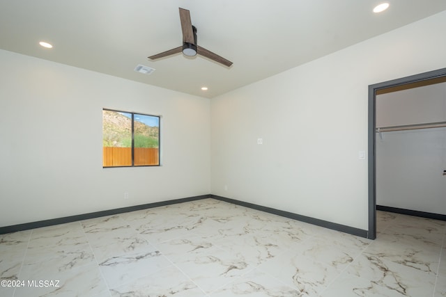 unfurnished room featuring ceiling fan