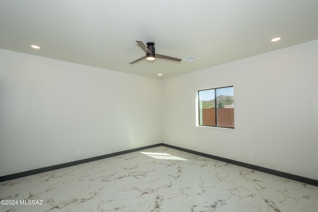 unfurnished room featuring ceiling fan