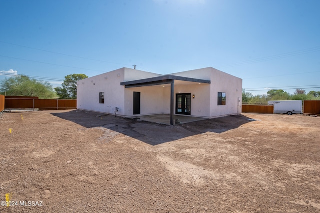 back of property with a patio area