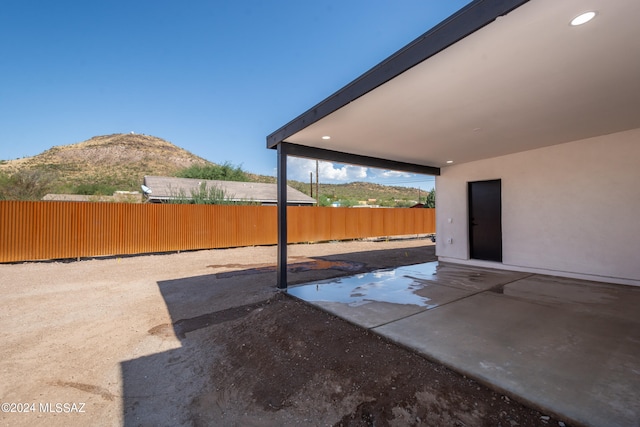 view of patio / terrace featuring a mountain view