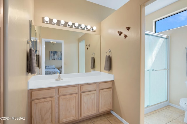 bathroom featuring tile patterned floors, toilet, vanity, ensuite bath, and a stall shower