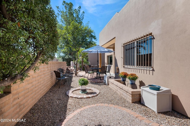 view of yard featuring fence and a patio