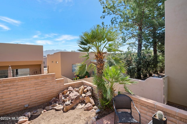exterior space featuring fence and a mountain view