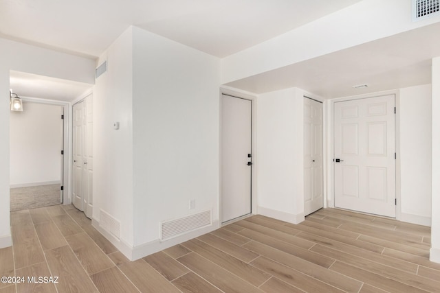 hall with light wood-type flooring