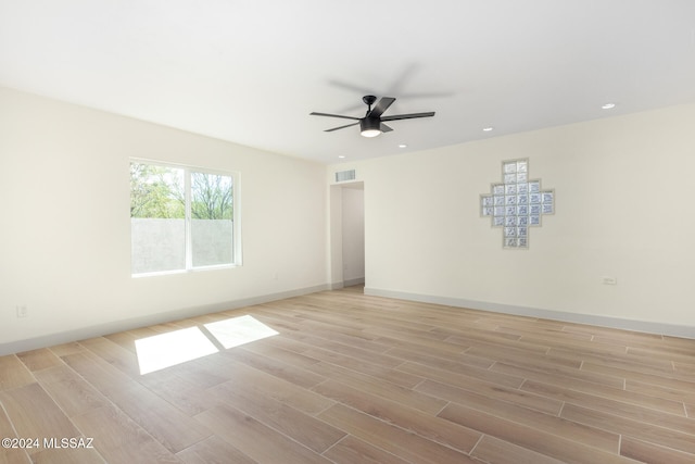 unfurnished room featuring light hardwood / wood-style floors and ceiling fan