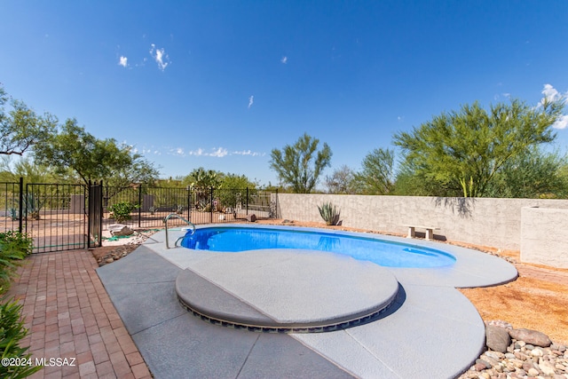 view of swimming pool featuring a patio area