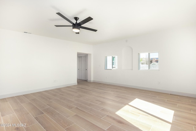 unfurnished room featuring ceiling fan and light hardwood / wood-style floors