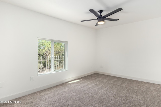 carpeted empty room with ceiling fan