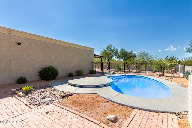 view of swimming pool featuring a patio