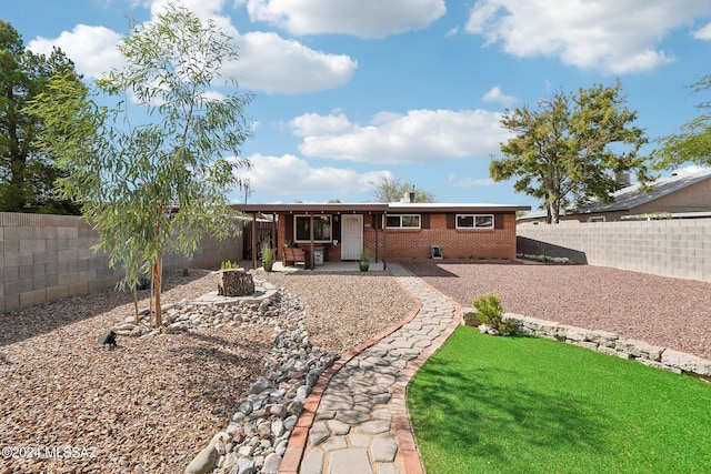 view of front facade with a patio and a front lawn