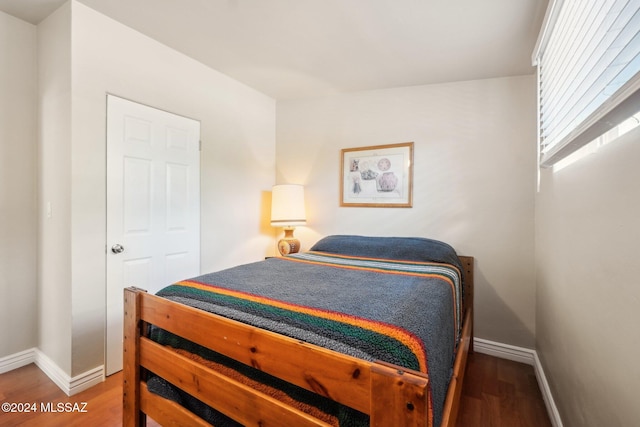 bedroom featuring hardwood / wood-style floors