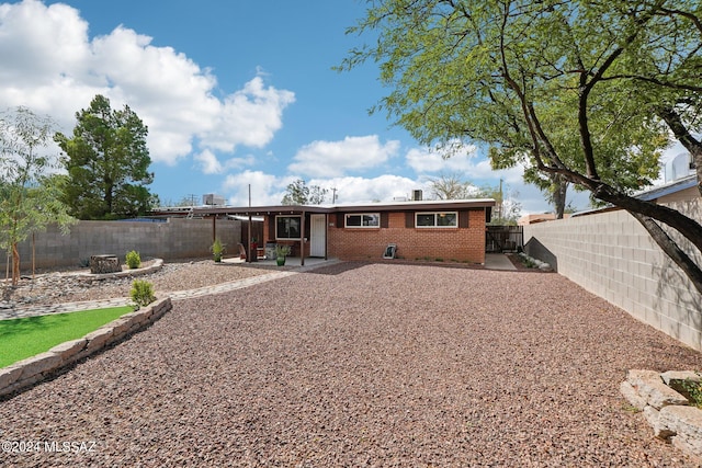 back of property featuring a patio area