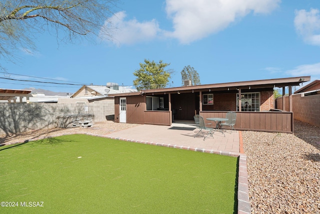 back of house featuring a patio area