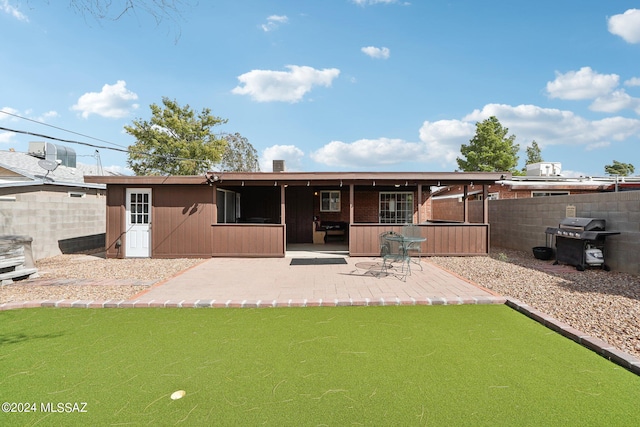 back of property featuring a patio