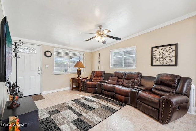 tiled living room with ornamental molding, vaulted ceiling, and ceiling fan