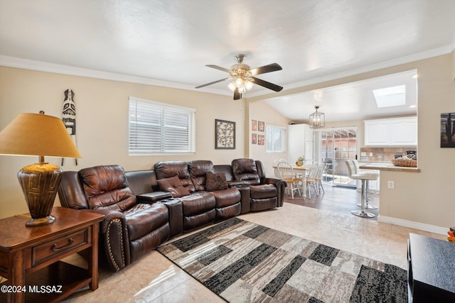 tiled living room with lofted ceiling, ornamental molding, and ceiling fan