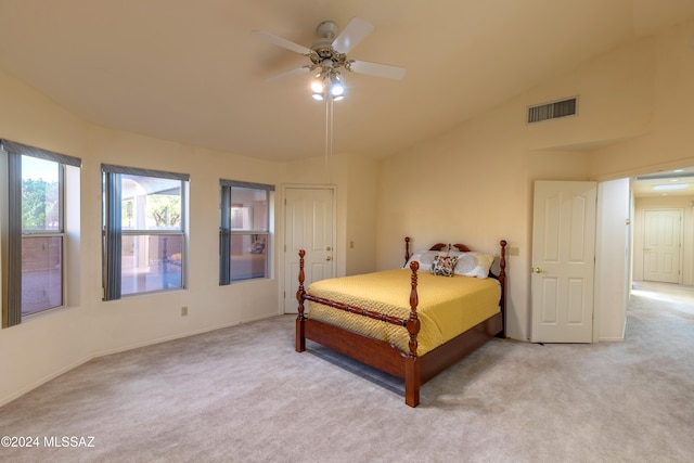 carpeted bedroom featuring ceiling fan, a closet, and lofted ceiling