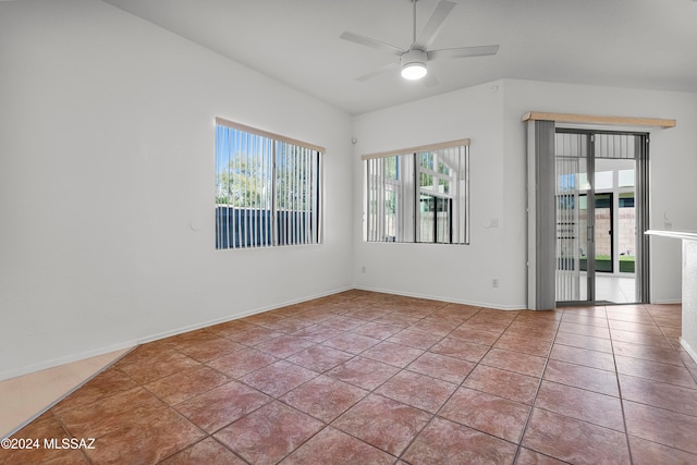 tiled spare room featuring ceiling fan