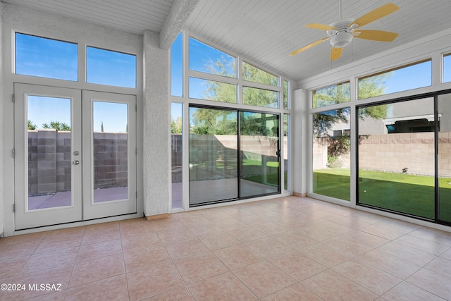 unfurnished sunroom with vaulted ceiling with beams, ceiling fan, and wood ceiling