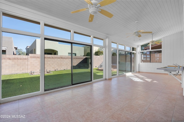 unfurnished sunroom featuring ceiling fan and wooden ceiling