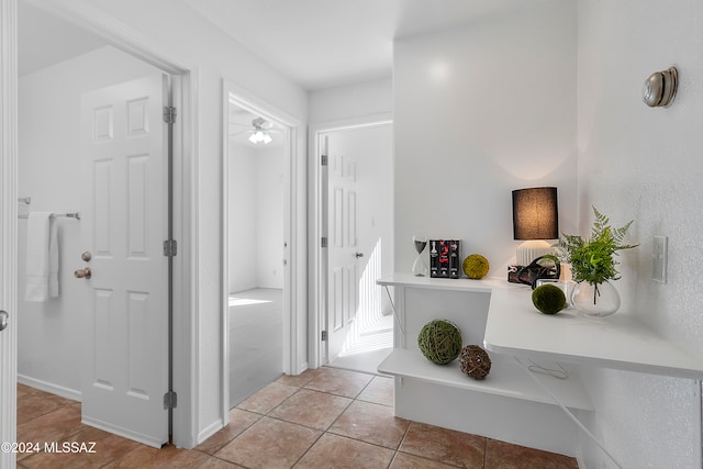 corridor featuring light tile patterned flooring