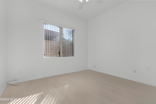 empty room featuring ceiling fan and light hardwood / wood-style floors