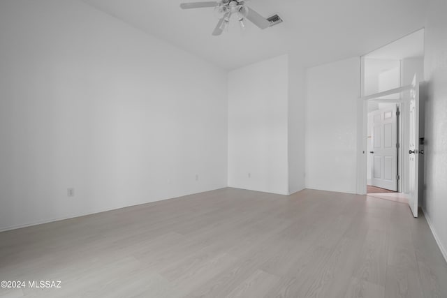 spare room with ceiling fan and light hardwood / wood-style floors