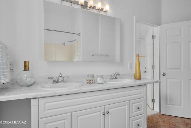 bathroom with vanity and tile patterned floors