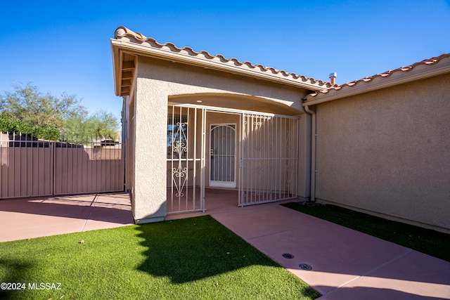 doorway to property with a patio area