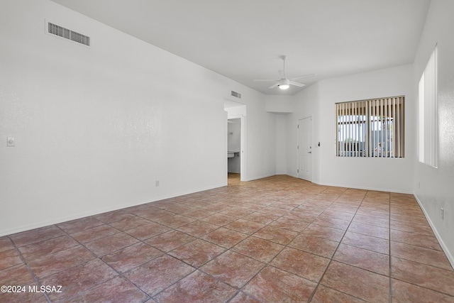 unfurnished room featuring ceiling fan and light tile patterned flooring