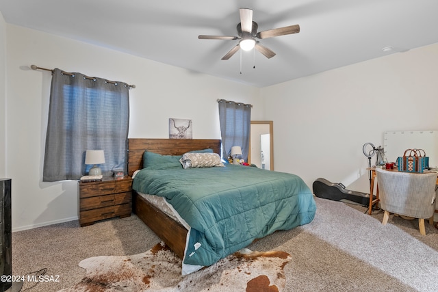 bedroom with light carpet and ceiling fan