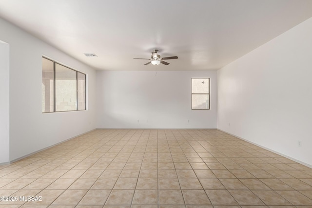 unfurnished room featuring a ceiling fan