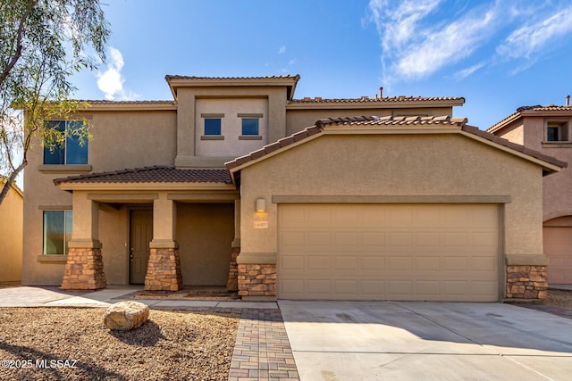 view of front of house with stone siding, an attached garage, driveway, and stucco siding