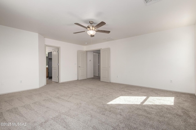 unfurnished bedroom with light carpet, visible vents, and a ceiling fan