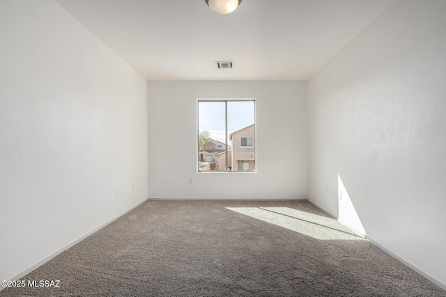 spare room with carpet floors and visible vents