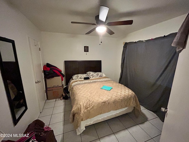 bedroom featuring light tile patterned floors and ceiling fan