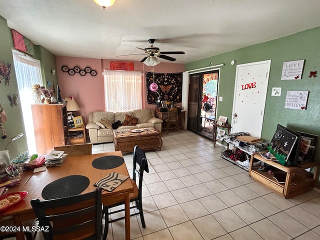 living room with ceiling fan and light tile patterned floors