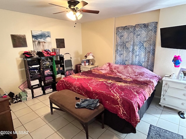 tiled bedroom with ceiling fan