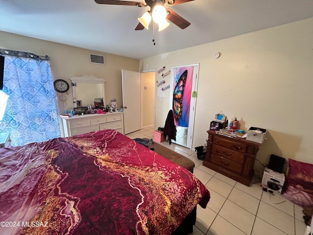 bedroom featuring light tile patterned floors and ceiling fan