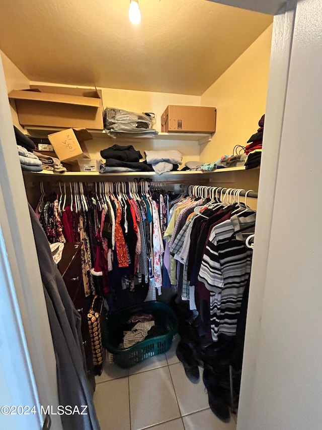 walk in closet with tile patterned flooring