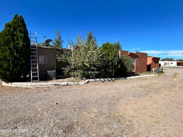 exterior space with central air condition unit