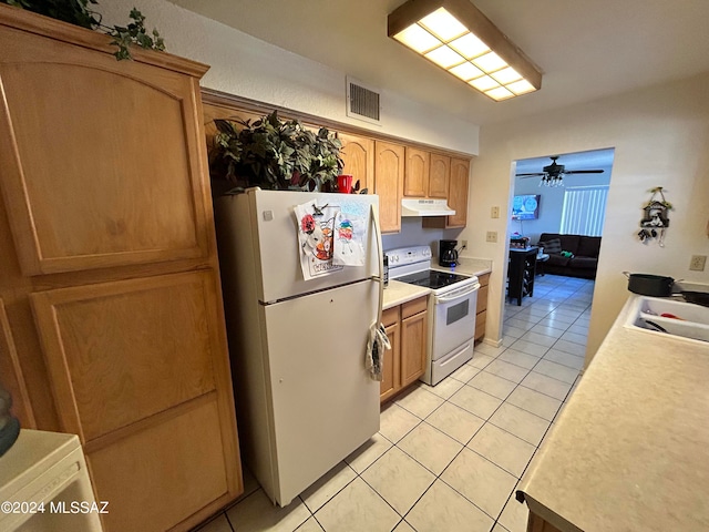 kitchen featuring white appliances, ceiling fan, light tile patterned floors, and sink