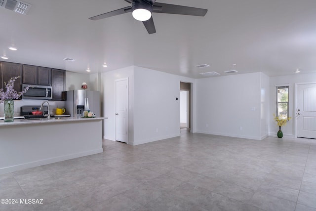 living room with light tile patterned flooring and ceiling fan