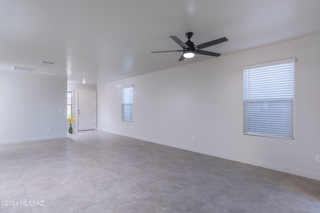 unfurnished room featuring ceiling fan