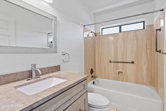 full bathroom featuring toilet, vanity, and washtub / shower combination