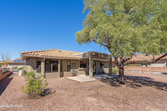 rear view of property with a patio